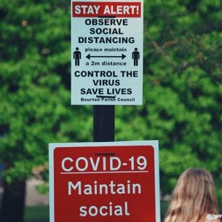 Social distancing signpost in Bourton-on-the-Water