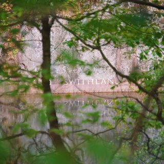 Swithland Wood - Carved inscription on the rock face by the water